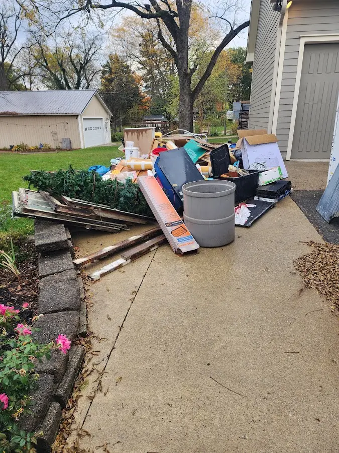 Dumpster being loaded with debris for Estate Cleanout Dumpster Rental in El Paso